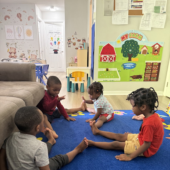 Children learning and playing together at Magic Balloon Childcare in Framingham